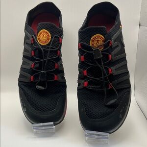 OluKai Men's Black Athletic Shoes with Red Accents and Yellow Logo Patch